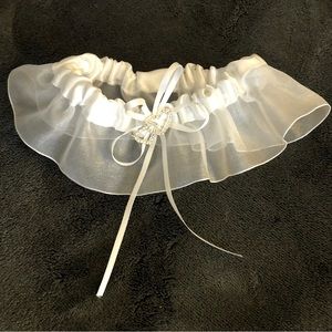 Bridal garter with rhinestone heart pin